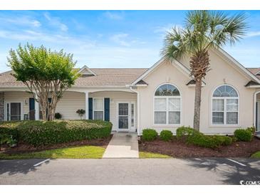 Inviting home with a well-manicured lawn, mature trees, and a charming exterior at 908 Wrigley Dr. # 17-3_17-3G, Myrtle Beach, SC 29588