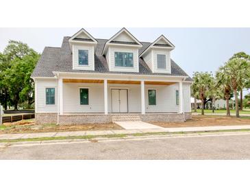 Charming new construction home featuring a brick foundation, covered porch, and gable roof at 105 Michau Rd., Georgetown, SC 29440