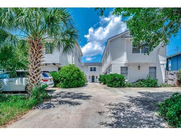 Charming exterior of connected home with concrete drive and mature landscaping at 2309 Withers Dr. # 5, Myrtle Beach, SC 29577