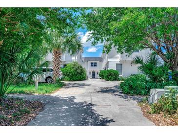 Exterior of a charming townhouse with lush landscaping and driveway at 2309 Withers Dr. # 7, Myrtle Beach, SC 29577