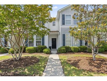 Charming townhome featuring a landscaped front yard and welcoming entryway at 314 Kiskadee Loop # 8-C, Conway, SC 29526