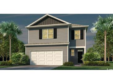 Two-story home features gray siding, black shutters, a white garage door and is surrounded by lush, tropical landscaping at 3591 Ashridge Way, Conway, SC 29526