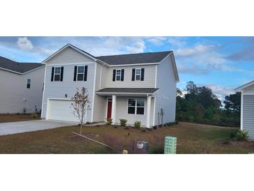 Charming two-story home features a classic design and well-maintained landscaping at 4013 Elmridge Ct., Conway, SC 29526