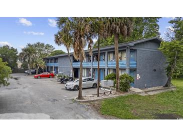 Charming two-story apartment complex with blue accents and well-maintained landscaping, plus ample parking at 505 28Th Ave. N, Myrtle Beach, SC 29577