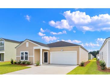 Charming one-story home featuring a one car garage, neutral siding, and a well-manicured lawn at 1000 Sentinel Ct., Little River, SC 29566