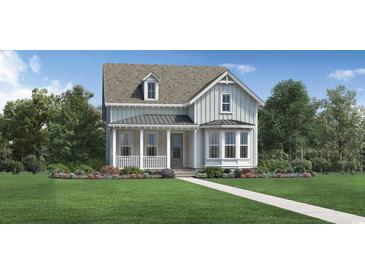 Charming two-story home with a welcoming front porch and a lush landscaped yard at 1401 Lancaster Way, Myrtle Beach, SC 29588