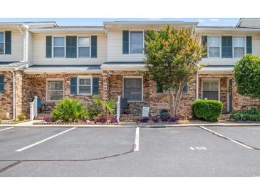 A welcoming condo shows parking spots and green foliage at 210 25Th Ave. S # 19, Myrtle Beach, SC 29577