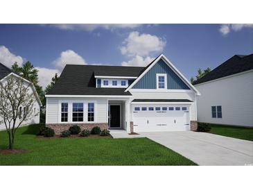 New construction exterior elevation with white siding, brick accents and an attached two car garage at 307 Dunlin Pl, Conway, SC 29526