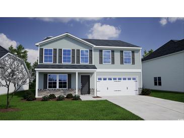 Two-story home features a two-car garage, stone accents, and a manicured lawn at 335 Garden Grove St, Conway, SC 29526
