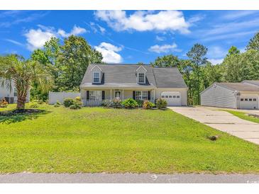 Charming single-Gathering home featuring a well-manicured lawn and inviting curb appeal at 340 Boxcar Dr., Longs, SC 29568