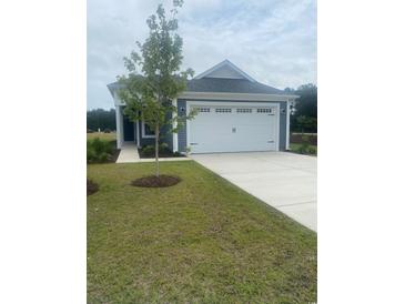 Charming one story home with a manicured lawn and two car garage at 1261 Saxon Ct., Myrtle Beach, SC 29579