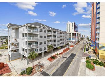 Beautiful exterior view of a condo building with balconies and street view at 3401 N Ocean Blvd. # 110, North Myrtle Beach, SC 29582