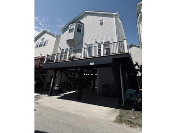 Coastal home featuring elevated construction, a spacious deck, and classic beach architecture at 6001-1168 S Kings Hwy., Myrtle Beach, SC 29575