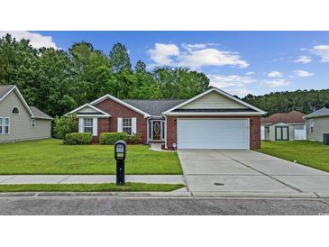 Charming single-story brick home featuring a well-manicured lawn and a two-car garage at 208 Hamilton Way, Conway, SC 29526