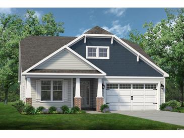 Charming single-Gathering home with a two-car garage, landscaped front yard, and welcoming front porch at 2214 Seagrape Dr., Little River, SC 29566