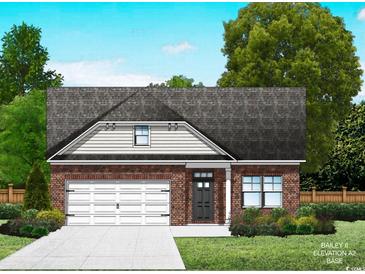 Charming brick home with an attached garage, landscaped yard and classic architectural details at 118 Westfield Circle, Conway, SC 29526