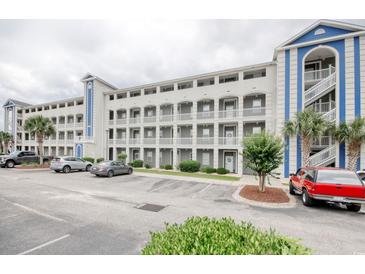 Condo building with multiple stories, balconies, and parking in front at 121 Waypoint Ridge Ave. # P-15, Little River, SC 29566