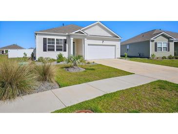 Charming single-Gathering home with well-manicured lawn and an attached two-car garage at 1723 Perthshire Loop, Myrtle Beach, SC 29579