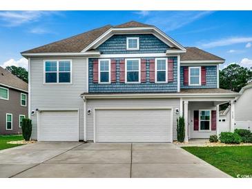 Charming two-story home with a three-car garage, gray siding, and red shutters at 5153 Country Pine Dr., Myrtle Beach, SC 29579