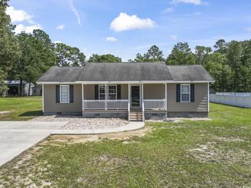 Charming single-story home with a cozy front porch and well-maintained lawn at 568 Rosedale Dr., Aynor, SC 29511