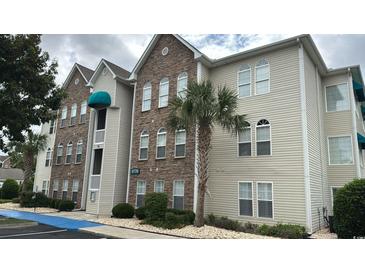 Attractive condominium complex with appealing stone and siding and well maintained landscaping at 9779 Leyland Dr. # 3, Myrtle Beach, SC 29572