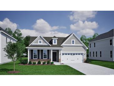 Charming single-Gathering home with stone accents, gray siding, and a two-car garage at 1064 Laconic Dr., Myrtle Beach, SC 29588