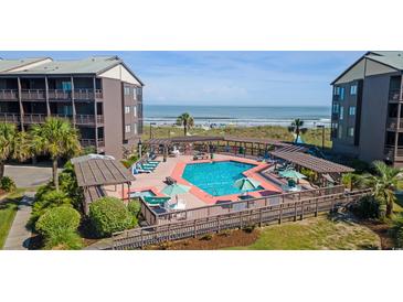 Inviting outdoor pool area near the beach, perfect for relaxation and enjoying the ocean view at 202 North Ocean Blvd. # 109, North Myrtle Beach, SC 29582