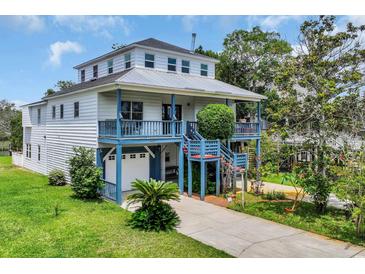 Charming home featuring a metal roof, double decks, and a convenient drive-under garage at 3659 Jordan Landing Rd., Murrells Inlet, SC 29576