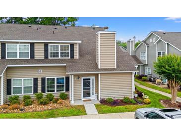 Charming two-story townhouse with black shutters, well-maintained landscaping, and a welcoming front entrance at 503 20Th Ave. N # 55B, North Myrtle Beach, SC 29582