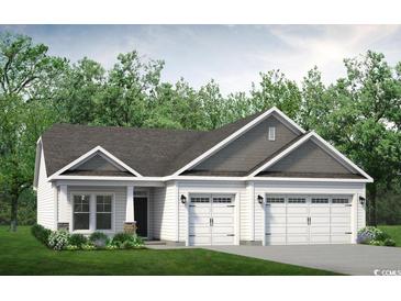 Charming single-story home with a three-car garage and well-manicured lawn at 718 Upton Way, Myrtle Beach, SC 29579