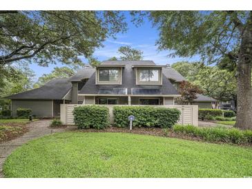 Charming townhome exterior features lush landscaping and a well-maintained facade at 213 Westleton Dr. # 16B, Myrtle Beach, SC 29572