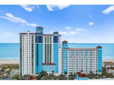 Stunning exterior of an oceanfront high rise building with a view of the beach and the ocean at 3000 N Ocean Blvd. # 333, Myrtle Beach, SC 29577