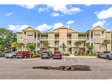 Beautiful condominium complex with private balconies, landscaping, and convenient parking at 35 Delray Dr. # 3A, Murrells Inlet, SC 29576