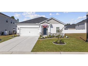 Charming single-story home featuring a manicured lawn and an attached two-car garage at 4206 Falls Oaks St., Myrtle Beach, SC 29579