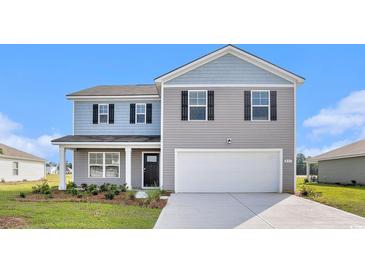 Charming two-story home with grey and blue siding, black shutters, and an attached two-car garage at 555 Strawberry Field Way, Galivants Ferry, SC 29544