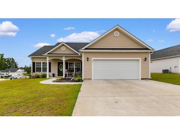 Charming single-story home featuring a two-car garage and a well-manicured front yard at 177 Baylee Circle, Galivants Ferry, SC 29544