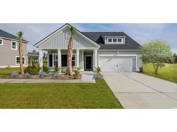 Charming one-story home with a well-manicured lawn, beautiful landscaping, and an attached two-car garage at 5051 Selene Ct., Myrtle Beach, SC 29588