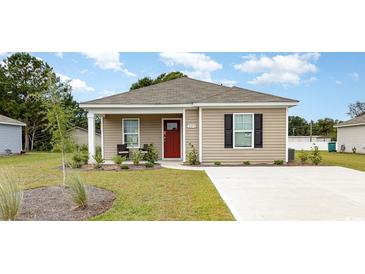 Charming single-story home with manicured lawn and a red front door, showcasing a welcoming facade at 651 Culmen Ct., Myrtle Beach, SC 29588
