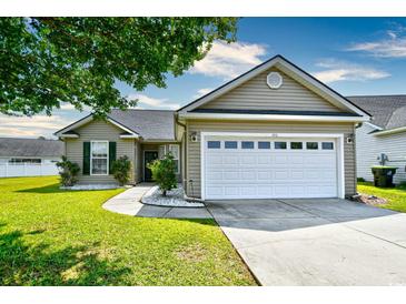 Charming home featuring a two-car garage and landscaped front yard at 1412 Reid Ct., Myrtle Beach, SC 29588