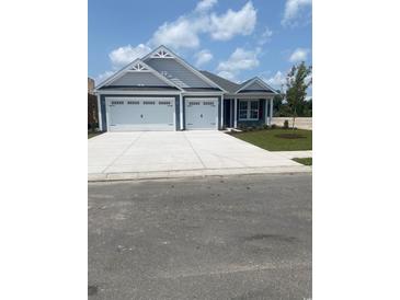 Charming single-story home featuring a two-car garage and a beautifully landscaped front yard at 236 Broughton Dr., Myrtle Beach, SC 29579
