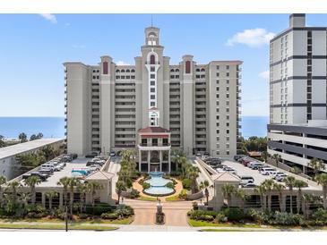 Stunning high-rise condo building with beautifully landscaped entrance, fountain, and ample parking at 5310 N Ocean Blvd. # Ph 6 1506, Myrtle Beach, SC 29577