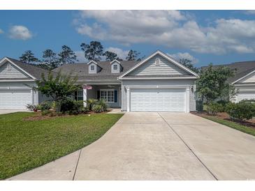 Charming single-story home with well-maintained landscaping and an attached two-car garage at 648 Sunnyside Dr. # 102, Murrells Inlet, SC 29576