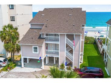 Coastal home with private balconies, landscaped yard, beach access, and ample parking near the ocean at 1615 S Ocean Blvd. # 4, Surfside Beach, SC 29575