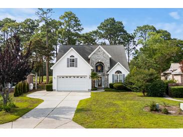 Charming two-story home boasts a manicured lawn and attached two car garage at 2077 N Berwick Dr., Myrtle Beach, SC 29575