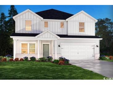 Charming two-story home with a white board and batten exterior and well-manicured front lawn at 4877 Hopespring St., Myrtle Beach, SC 29579