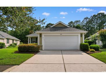 Well-maintained, one-story home with an attached two-car garage and manicured landscaping at 821 Laquinta Loop, Murrells Inlet, SC 29576