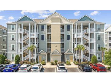 Inviting condo building with multiple units and convenient parking spaces in front at 172 Ella Kinley Circle # 101, Myrtle Beach, SC 29588