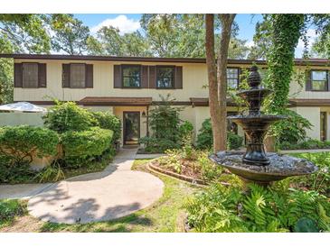Charming townhome featuring a lush landscaped front yard with a beautiful fountain at 315 73Rd Ave. N # 2, Myrtle Beach, SC 29572