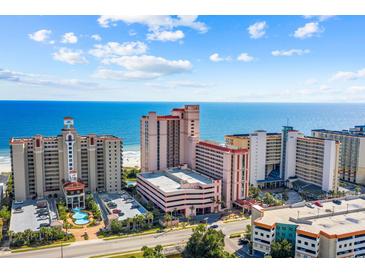Stunning aerial view of the hotel resort with ocean view, multiple pools, and lush landscaping, perfect for a relaxing vacation at 5308 N Ocean Blvd. # 1202, Myrtle Beach, SC 29577