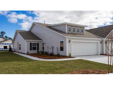 Charming single-Gathering home featuring a two-car garage, well-manicured lawn, and a classic light-gray facade at 7001 River Bridge Ct, Myrtle Beach, SC 29579